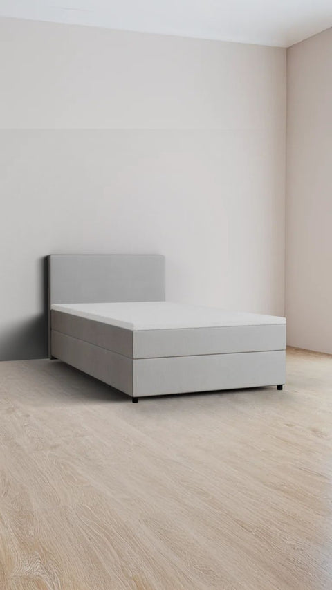 Grey single boxspring bed 90x210 cm